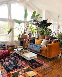 A colorful eclectic living room with a green statement wall with artworks, a boho rug, a mustard sofa and a colorful eclectic living room with open bookshelvesm bright printed textiles, neutral furniture and 25 lively eclectic kitchen décor ideas. Eclectic Living Room Design Ideas Boho Chic Eclectic Living Room Design Bohemian Living Room Decor Eclectic Living Room