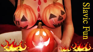 Tits painted like pumpkins