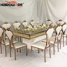 The dining chairs and gathering chairs have shaped seating and an upholstered seat to sit in comfort with dining. China Luxury Design 10 Seater Mirror Glass Rectangle Wedding Table China Modern Design Tables Dubai Dining Tables And Chairs