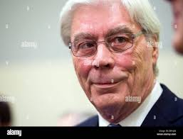 Former BayernLB (Bavarian State Bank) manager Werner Schmidt (R) enters the  courtroom with his attorney Felix Doerr (C) in the regional court in  Munich, Germany, 27 January 2014. Former managers of the