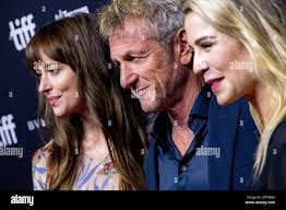 Dakota Johnson, from left to right, Sean Penn and Christy Hall attend the  premiere of "Daddio" at the TIFF Bell Lightbox during the Toronto  International Film Festival, Sunday, Sept. 10, 2023, in