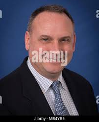 Department of the Navy Superior Civilian Service Award winner John Babb  (back row, third from left) displays his certificate as he is joined