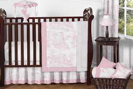 The red and cream polka dot pattern on the underside of the duvet gives the design a fun twist. Pink Toile 11 Piece Bumperless Crib Bedding Collection