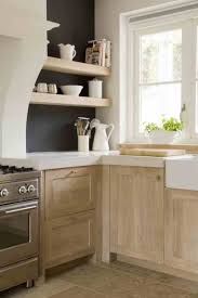 White Work Surfaces On Limed Oak Natural Wood Kitchen Cabinets Natural Wood Kitchen Wood Kitchen Cabinets