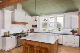 White Cabinets Alder Wood Island Tongue And Groove Ceiling Painted Green Wood Accents Light Wood Floors W Vaulted Ceiling Kitchen Kitchen Remodel Kitchen