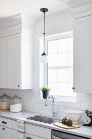 bronze vintage light over kitchen sink
