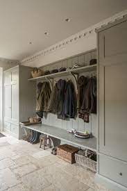 Boot Room With Built In Cabinetry And Rustic Stone Floor Design By Artichoke In England English Country Kitchens Boot Room Country Kitchen Designs