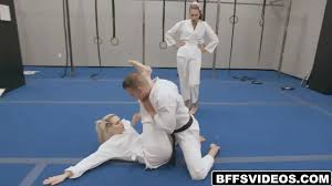 The girls make their move licking and sucking Codeys fat cock in the middle  of the dojo - XNXX.COM