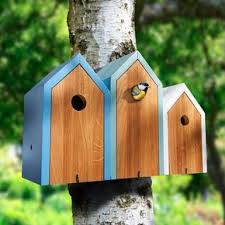 Nistkasten Reihenhaus Eine Frohliche Nachbarschaft Besiedelt Jetzt Ihren Garten Schon Wohnlich Und Dekora Nistkasten Bauen Dekorative Vogelhauser Nistkasten