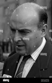 Argentine Economy Minister Domingo Cavallo, flanked by Labor Minister Armando  Caro Figueroa, right, raises a glass during a government cabinet meeting in  Buenos Aires, Thursday July 25, 1996. Speculation over Cavallo's future