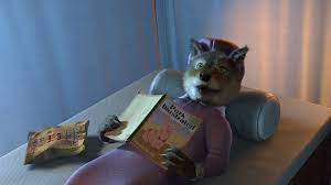 In Shrek 2, the big bad wolf is eating chips while reading a porn magazine.  The chips are on the right, so he is likely right handed. Meaning he eats  food with