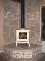 Adding a wood stove to your home will add efficient heat to a cold room, but it can also be used as a decorative piece of furniture. Tiled Wood Stove Hearth In The Preview At Least On My Laptop The Stove Looks So Bright It Wood Stove Hearth Corner Wood Stove Wood Stove