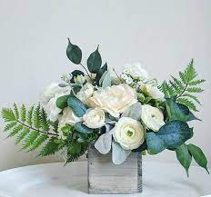 Centerpiece Floral Arrangement In Ivory Cream And Greenery Ranunculus Silver Dollar Eucal Greenery Floral Arrangement Floral Arrangements Flower Arrangements