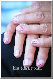 The nail polish sticks on the surface of the vase, creating a beautiful marble effect. Water Marble Nail Polish The Idea Room