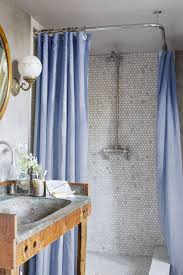 Navy blue hues repeat on this shower's floor tile and shelving backsplash. 20 Popular Bathroom Tile Ideas Bathroom Wall And Floor Tiles