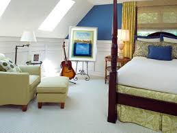 As seen on hgtv.com, a small bedroom features the artwork of italian renaissance painter dosso dossi as a headboard, a wood platform bed, a faux fur throw, white bed linens, an inverted trapezoid table, yellow pillows highlighted by daffodils. 5 Expert Small Bedroom Storage Ideas Hgtv