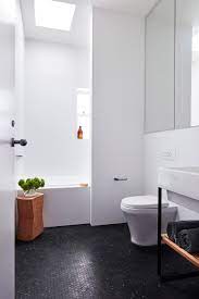 Bathroom flooring can make a big statement, whether it's a large master bathroom or a small powder room. Maroubra House By Those Architects Black Bathroom Floor Black Bathroom Mosaic Bathroom Tile