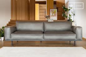 Living room with a leather armchair. Almond 3 Seater Sofa In Grey Leather Pib