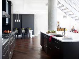 Since black and white kitchens offer you a perfect neutral backdrop, your wood accent additions will stand out instantly. Black Kitchens Are The New White Hgtv S Decorating Design Blog Hgtv