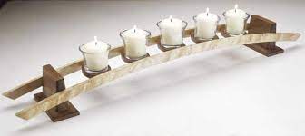 Reuse rustic wood from your store leftovers to make these long candlestick holders. Candles On A Curve Woodworking Plan From Wood Magazine