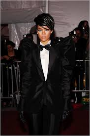 Black And White Suit With Red Bow Tie Rihanna Is Bending Her Gender In This Classic Black Suit Crisp White Shirt And Bow Tie Suits Are Typically Worn By Workin Tuxedo Women Met Gala Looks Fashion