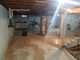 Water will leak through the basement walls, or even up through the center of the basement floor. Woods Basement Systems Inc Basement Waterproofing Photo Album Red Bud Illinois Water Stained Basement Floor Protected With Waterguard