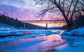 Icy Delaware River Reflects The Vivid Sunset Near Milford