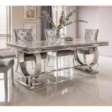 A longtime favorite for kitchen countertops and islands, marble takes center stage in the dining room. Kesley Marble Dining Table In Grey With Stainless Steel Base Sale