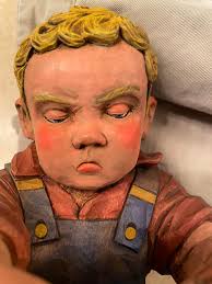 Where to confirm authenticity of a carving by Enlow?