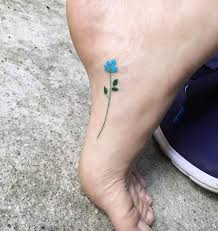 Blue rose tattoo on foot. 50 Enchanting Flower Tattoos For Fall Tattooblend