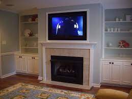 If it isn't, it's probably because it is facing your older tv and you wish that you could make the fireplace the focal point and fill that blank space above it or replace that family portrait with a nice big tv. Contemporary Fireplace Designs With Tv Above Novocom Top