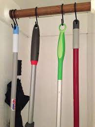 They also work great in the clothes closet to hang belts or umbrellas. Use S Hooks Ti Hang Mops Brooms Dusters And Other Cleaning Tools Closet Room Organizer Cleaning Closet Organization Utility Closet Organization Ideas