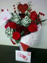 Wrap green florist's tape around the skewer, starting from the bottom. Red Roses Wrapped In 100 Dollar Bills