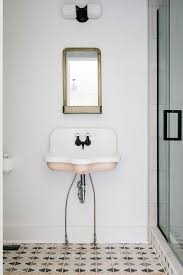 pink basin sink with vintage mirror