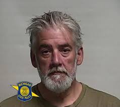 Grayling man charged with assault of woman