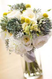 Succulents Dahlias Garden Roses Cream Lisianthus Craspedia And Dusty Miller The Stems Were Wrapp Wedding Flowers Garden Rose Bouquet Wedding Flower Photos