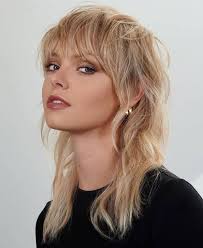 Who can give a good modern mullet, blowout taper, or textured fringe  haircut in the Loveland/Fort Collins area?