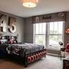 Add a fun baseball theme bed or novelty baseball headboard, for your little sportsman to sleep and play in. 3