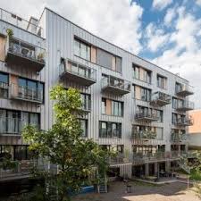 Brutopia Is An Aluminium Clad Apartment Complex Built By A Cooperative In Brussels Dezeen Architecture Architecture Exterior Apartments Exterior