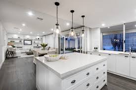 Existing windows were relocated and windows and doors added to allow for more light and easier access to outdoor spaces. Five Elements That Define Hamptons Style Homes Stannard Homes