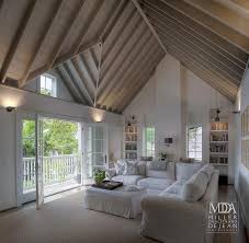 Fabulous Family Room Features Cathedral Ceiling Accented With Wood Beams Over White Vertic Vaulted Ceiling Living Room Family Room Walls Family Room Wall Decor