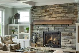 Most people have been purchasing the newer versions of fireplaces which complements. Rustic Stone Fireplace Illuminates This Traditional Living Room Living Room Detroit By Cultured Stone Houzz