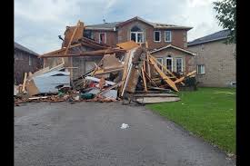 Damage from tornado shows car flipped over and roofs ripped off homes in barrie, ontario on july 15, 2021. Op Wgo8 Qcnscm