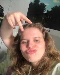 the face of an emerging musical theater writer/performer who is doing a  show at 54 below