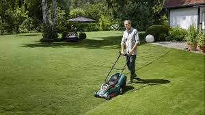 There is a big garden with a beautiful. Best Lawn Mower 2021 The Top Electric Cordless And Manual Mowers Expert Reviews