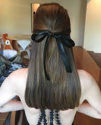 A black satin ribbon scrunchie featuring an oversized hair bow, adding fun and femininity to your hair style. 8 Best Black Hair Ribbon Ideas Hair Long Hair Styles Hair Styles