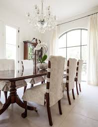 Large Format White Tile Flooring Continues In Here Lending The Deep Rich Wood Table And Dining Room Chair Slipcovers Slipcovers For Chairs Dinning Room Chairs