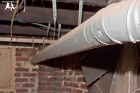 The furnace is located in the garage and has the exhaust coming out. Install A Vent Flue For A 95 Efficient Condensing Gas Furnace Diy Old House Crazy