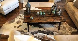 Cowhides on the wall while a cowhide rug looks absolu Best Cowhide Rugs For Your Home In 2021 Full Home Living