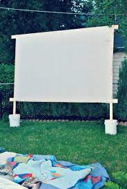 Make Your Own Movie Screen For Outdoor Movie Nights Simple And Inexpensive Made With A Drop In 2020 Diy Outdoor Movie Screen Backyard For Kids Outdoor Movie Screen